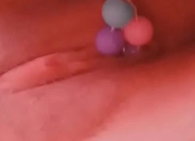 Japanese girl using beads on her virgin pussy