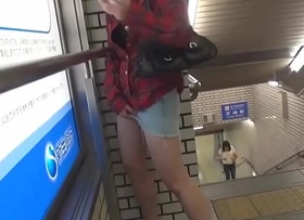 Asian ho urinates in metro station