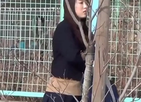 Oriental students in uniforms peeing