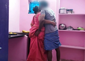 Aunty was searching of a fallen mango in the kitchen and I went behind her and grabbed her rear and licked her pussy wit