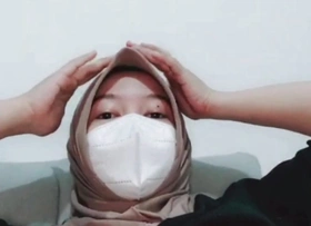 This hijab girl masturbates in her room alone