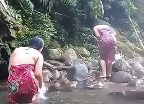 Spectacular ladies having bath outdoor