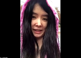 Chinese Teen stars in Bollywood Spectacular and then flashes big breasts outdoors in the rain