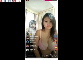 Chubby asian with beamy tits blinking